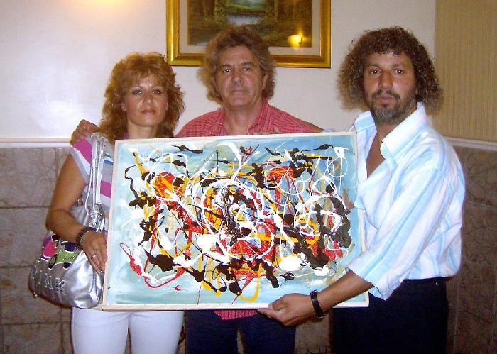 Sanremo, una tela di Gerlando Meli in dono a Fausto Leali